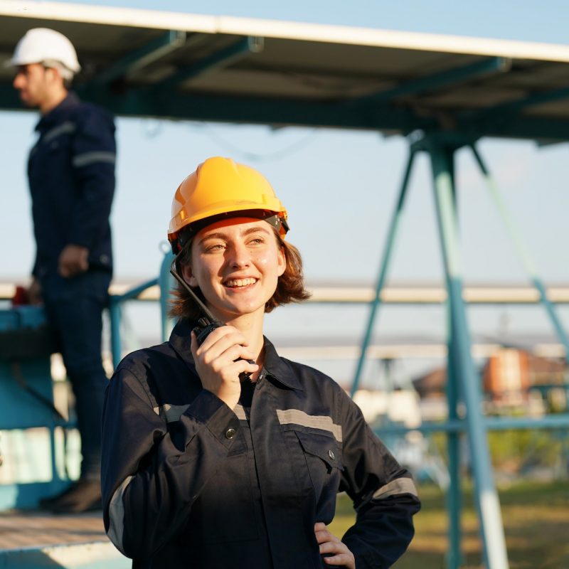 engineers-installing-solar-panels-on-roof-male-engineers-walking-along-rows-of-photovoltaic-panels.jpg
